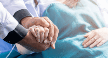 why take part in research - A practitioner consoling a patient
