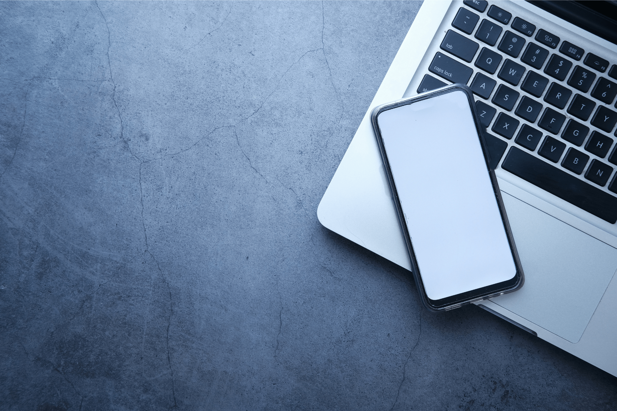 Laptop and mobile phone on a desk