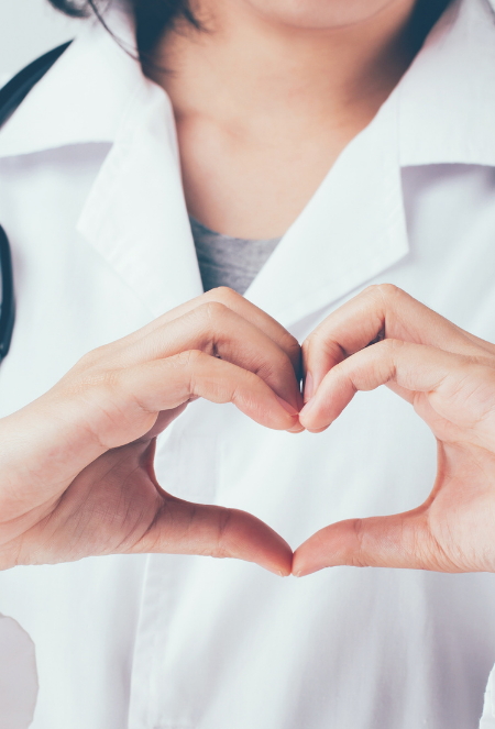 Doctor forming heart shape with hands