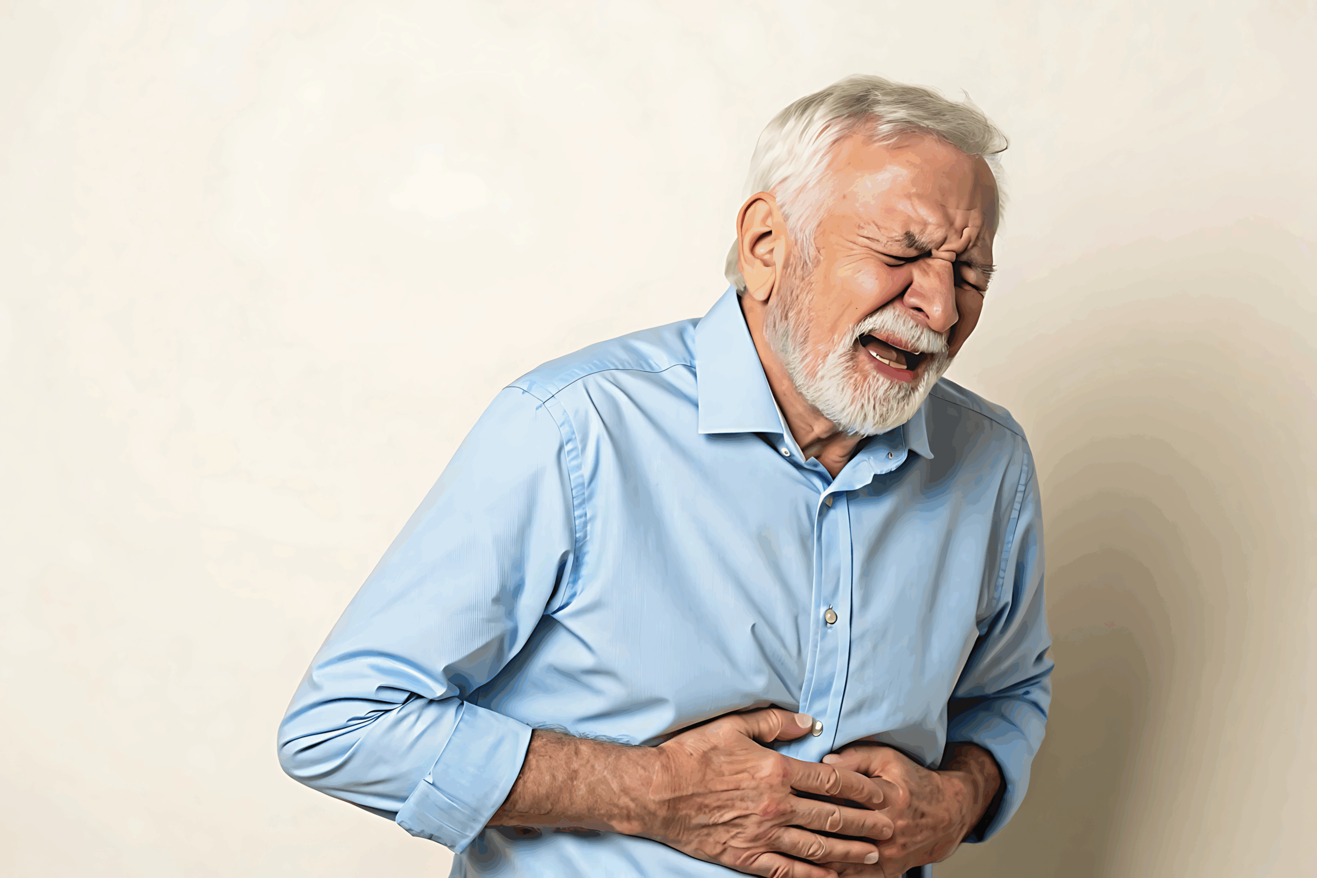 Older gentleman experiencing stomach pain
