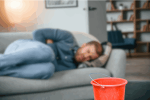 Man suffering with a serious stomach bug infection