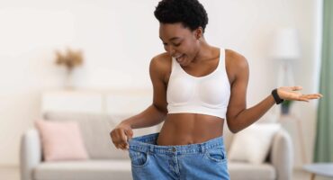 Weight loss - woman experiencing joy through a change in her size